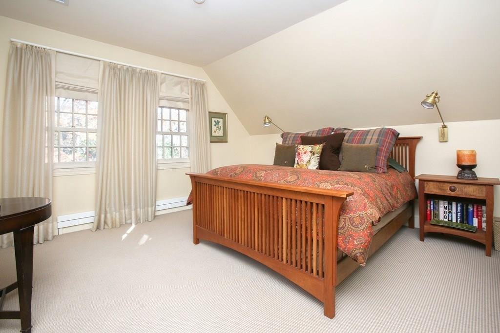 97 Laurel Road Brookline, MA 02467 - Photo 18 of 33 a bedroom with a bed and a window