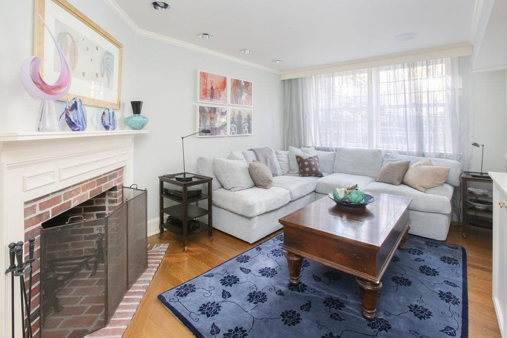 97 Laurel Road Brookline, MA 02467 - Photo 21 of 33 a living room with furniture and a fireplace