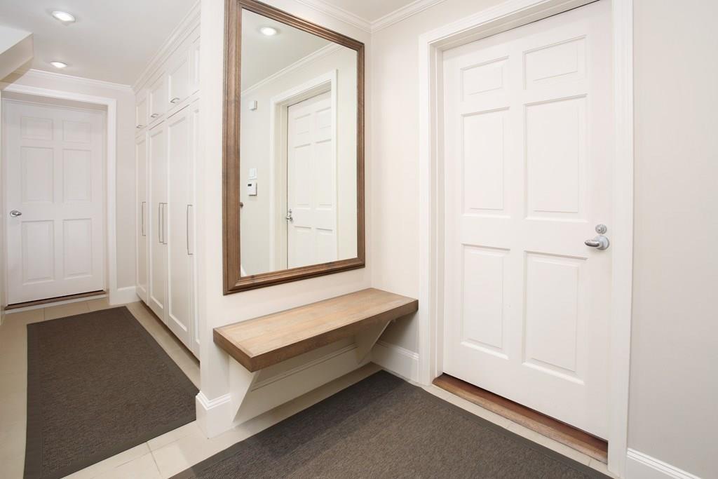 97 Laurel Road Brookline, MA 02467 - Photo 24 of 33 a spacious bedroom with a bed and a window