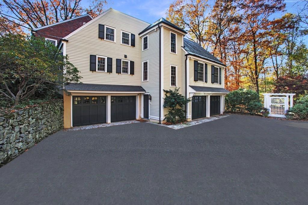 97 Laurel Road Brookline, MA 02467 - Photo 26 of 33 a front view of a house with a yard and garage
