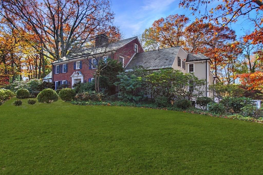 97 Laurel Road Brookline, MA 02467 - Photo 27 of 33 a front view of a house with garden