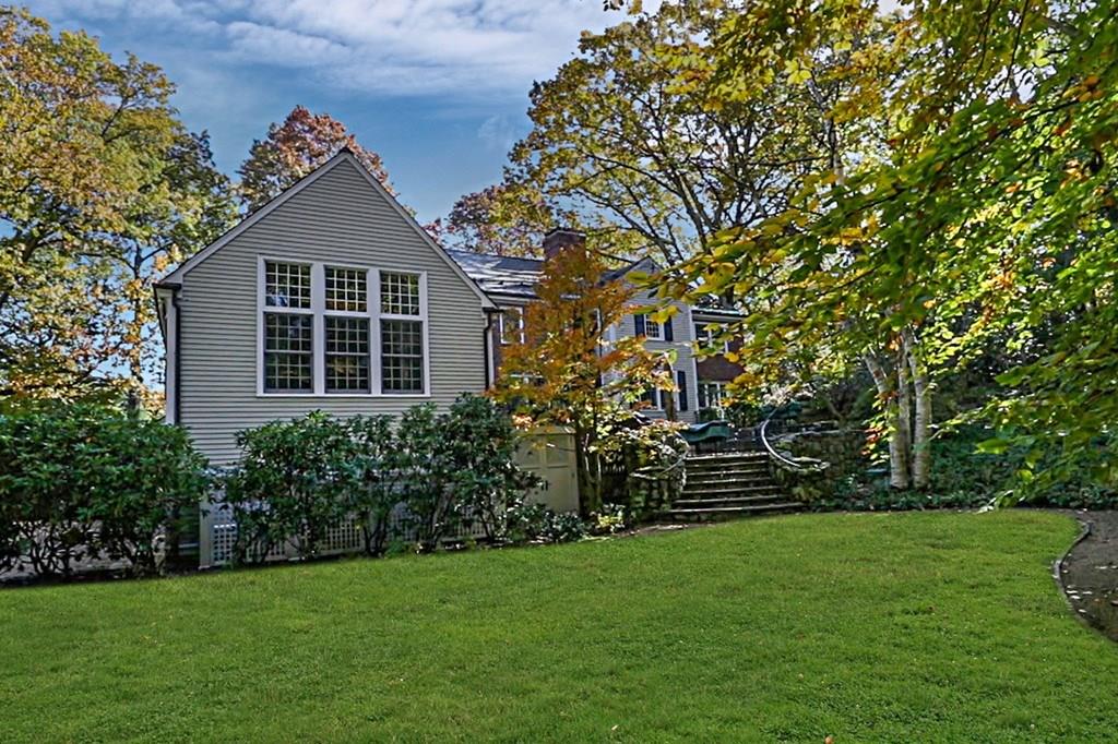 97 Laurel Road Brookline, MA 02467 - Photo 30 of 33 a front view of a house with a yard