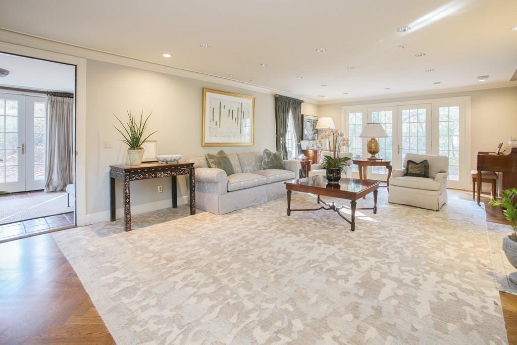 97 Laurel Road Brookline, MA 02467 - Photo 4 of 33 a living room with furniture and a potted plant