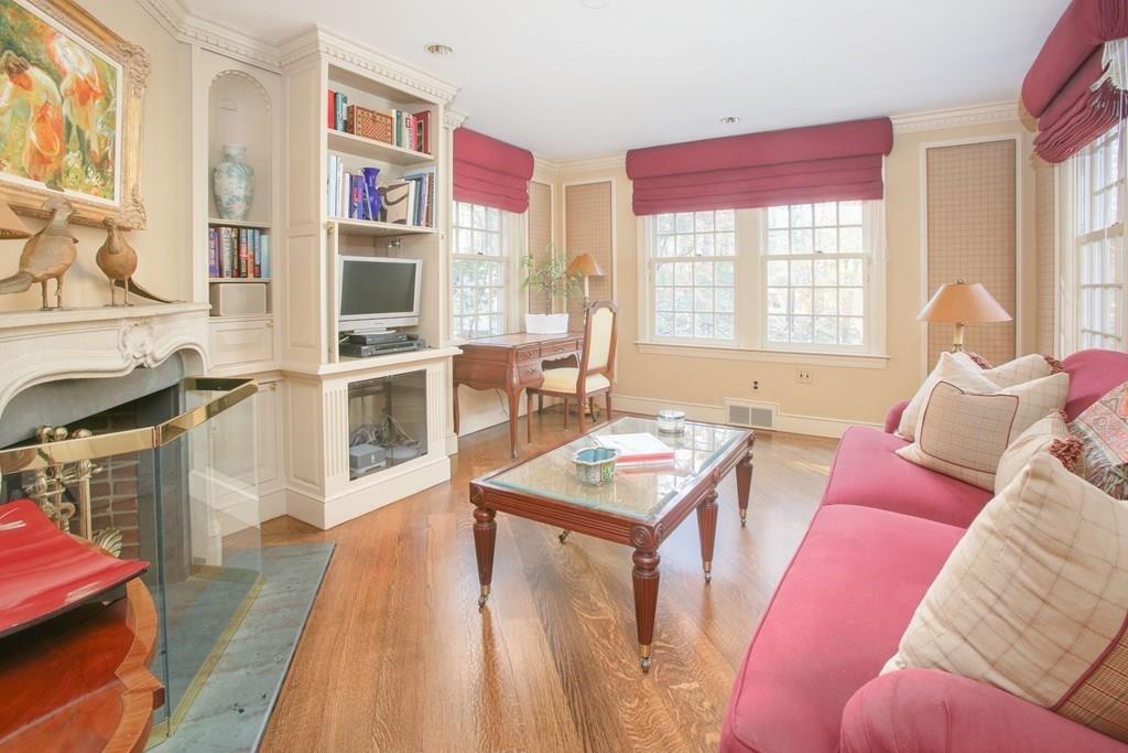 97 Laurel Road Brookline, MA 02467 - Photo 10 of 33 a living room with furniture a flat screen tv and a table