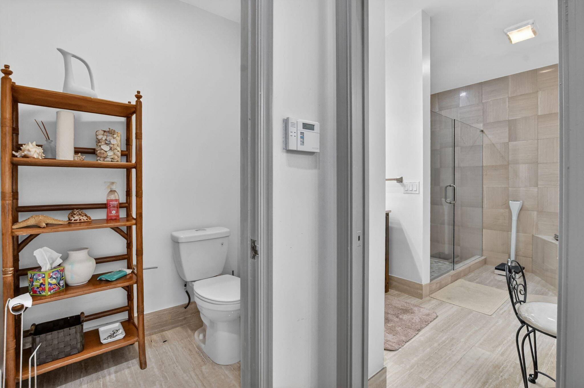22519 Esplanada Circle, Unit W Boca Raton, FL 33433 - Photo 32 of 57 a bathroom with a sin toilet and shower