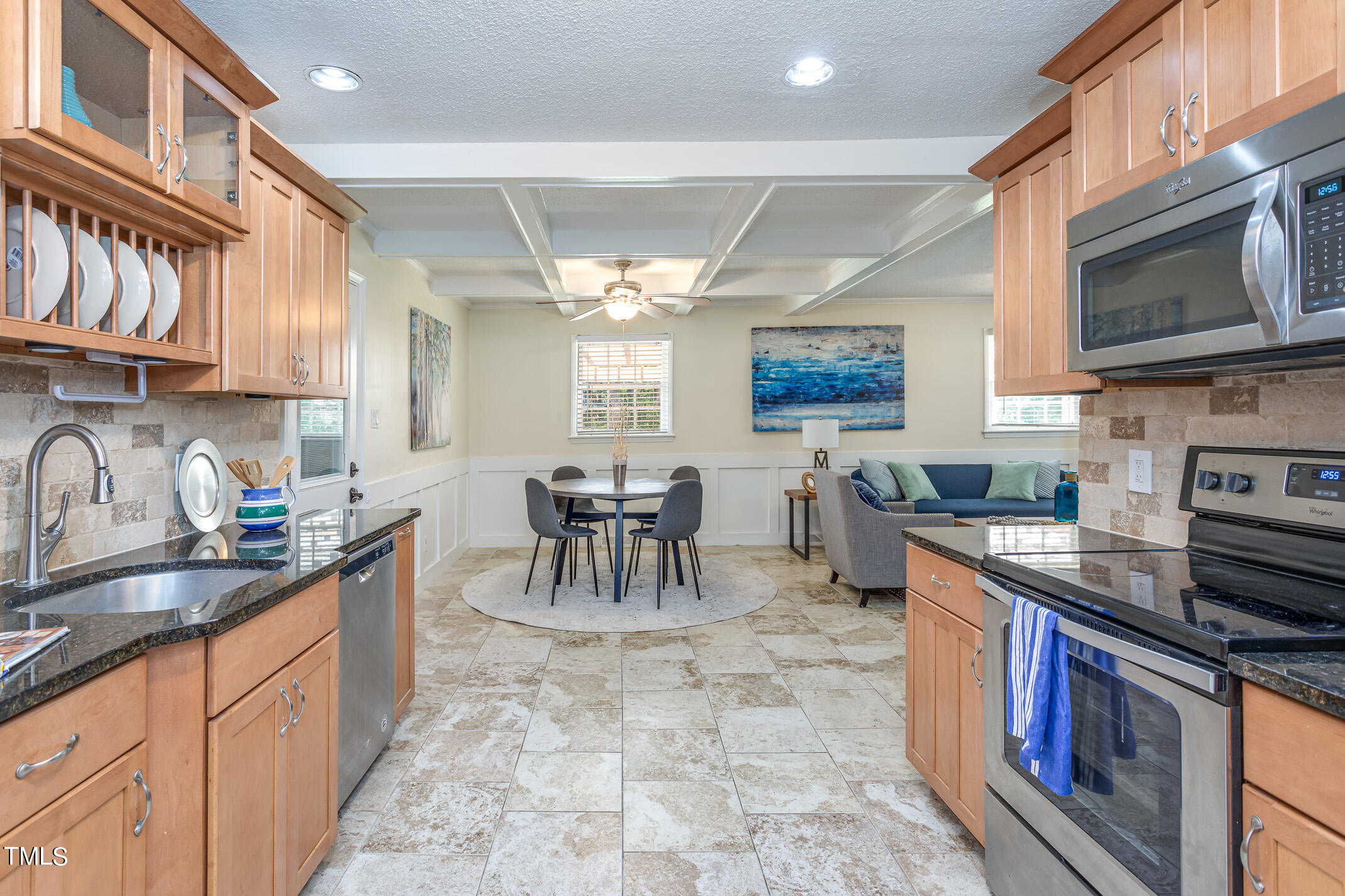 1717 Bayleaf Trail Raleigh, NC 27614 - Photo 16 of 35 a kitchen with stainless steel appliances granite countertop a stove top oven a sink a counter space and cabinets
