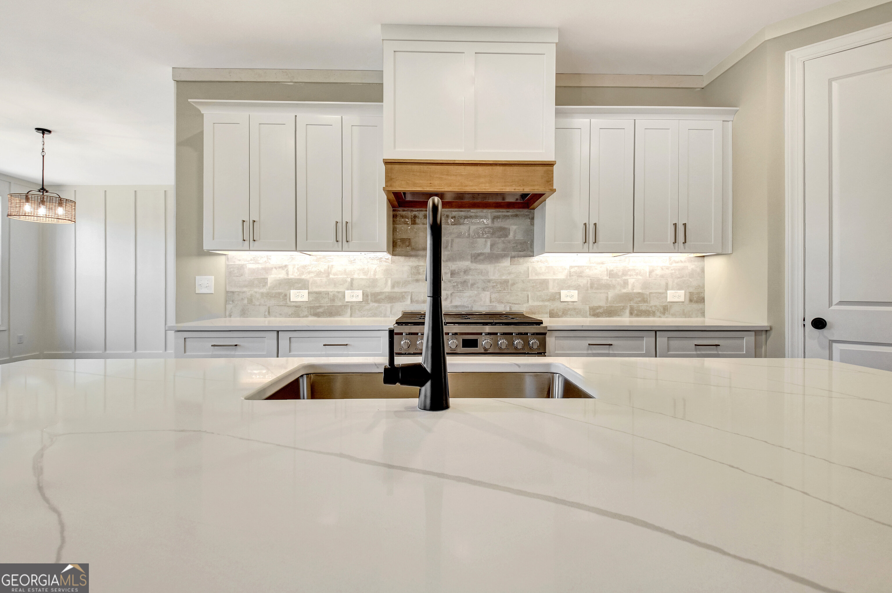 355 Werner Way Senoia, GA 30276 - Photo 25 of 118 a kitchen with granite countertop a sink and a stove