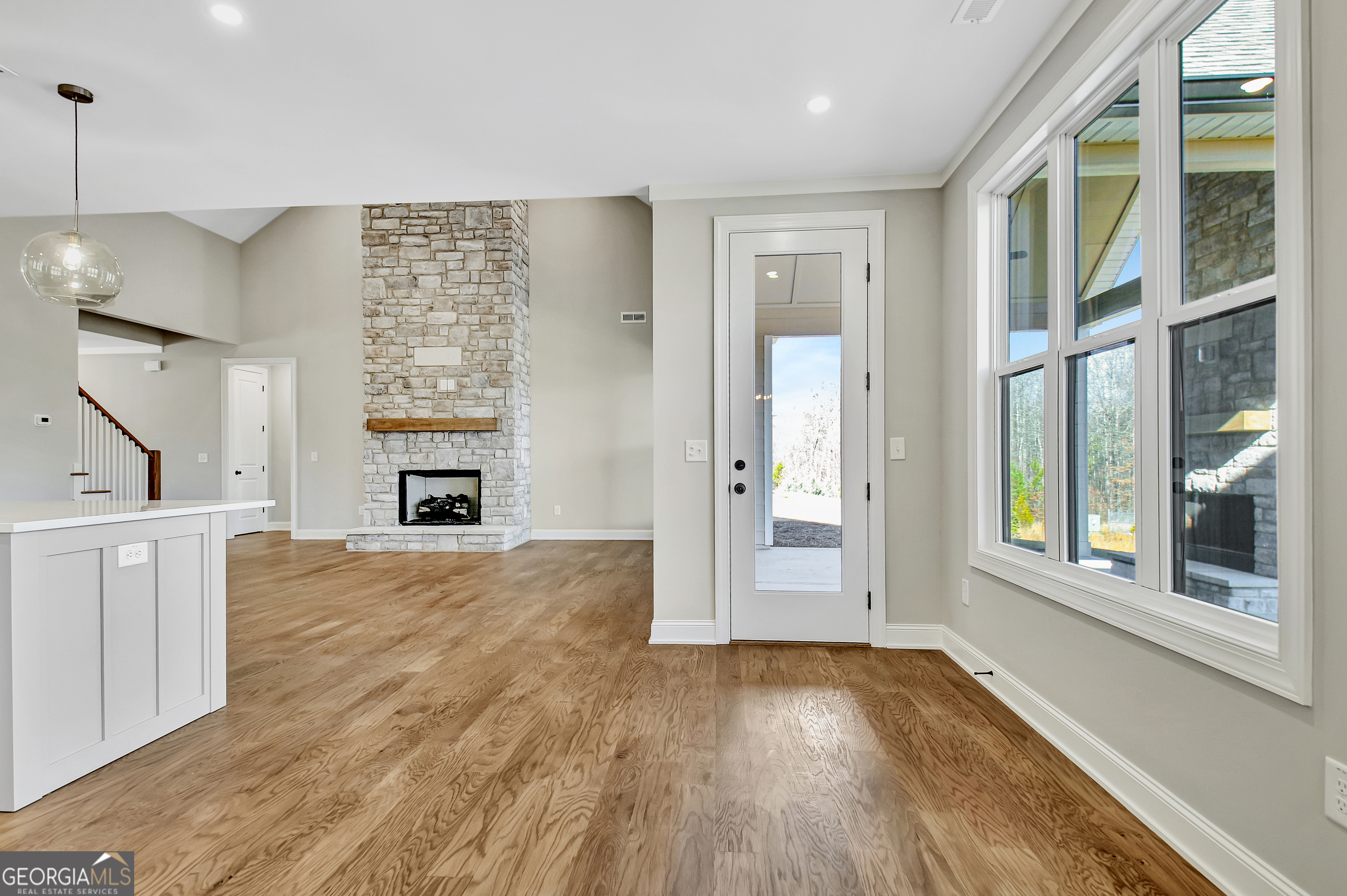 355 Werner Way Senoia, GA 30276 - Photo 39 of 118 a view of an empty room with window and wooden floor