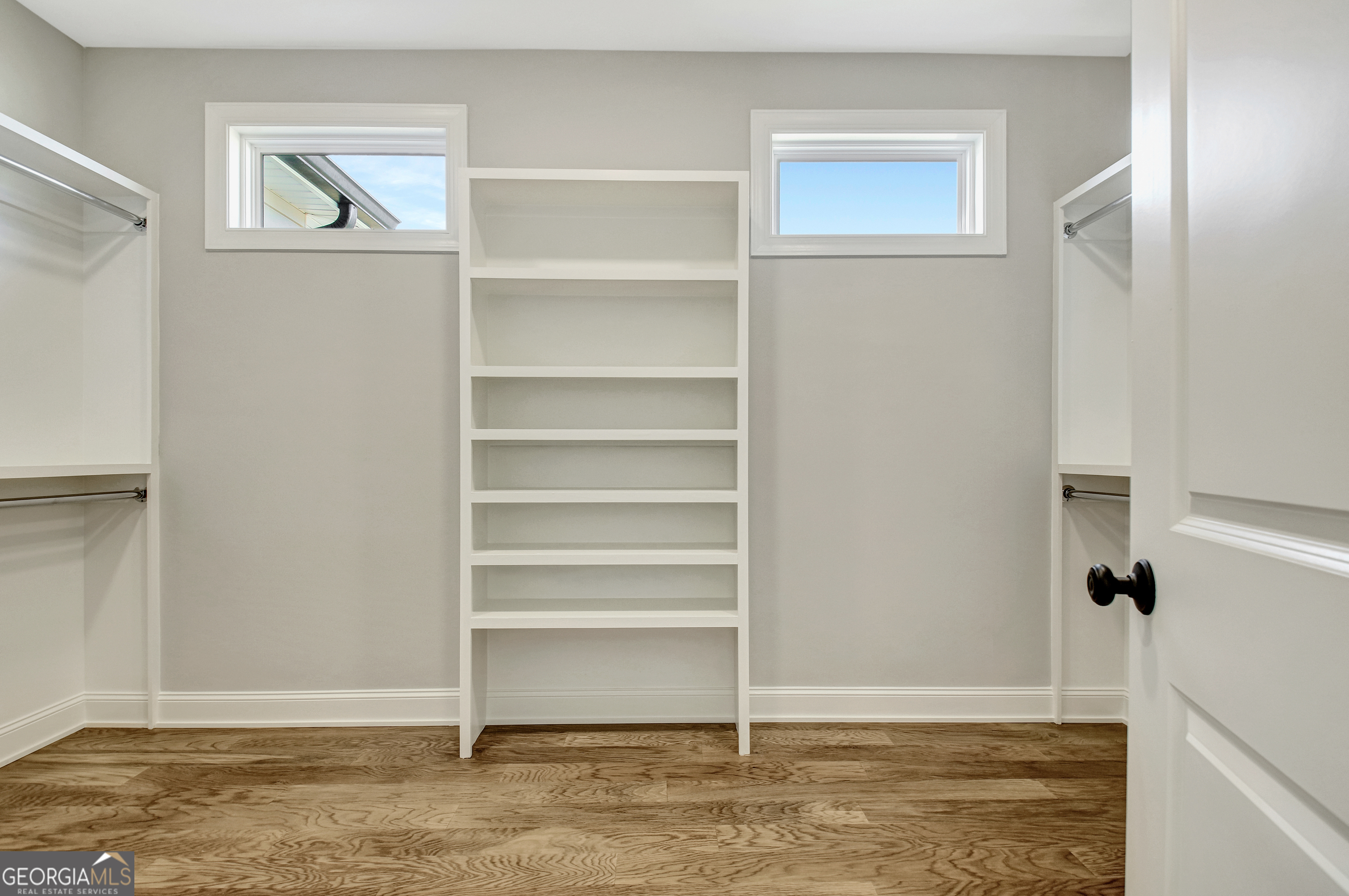 355 Werner Way Senoia, GA 30276 - Photo 55 of 118 a view of walk in closet with empty racks