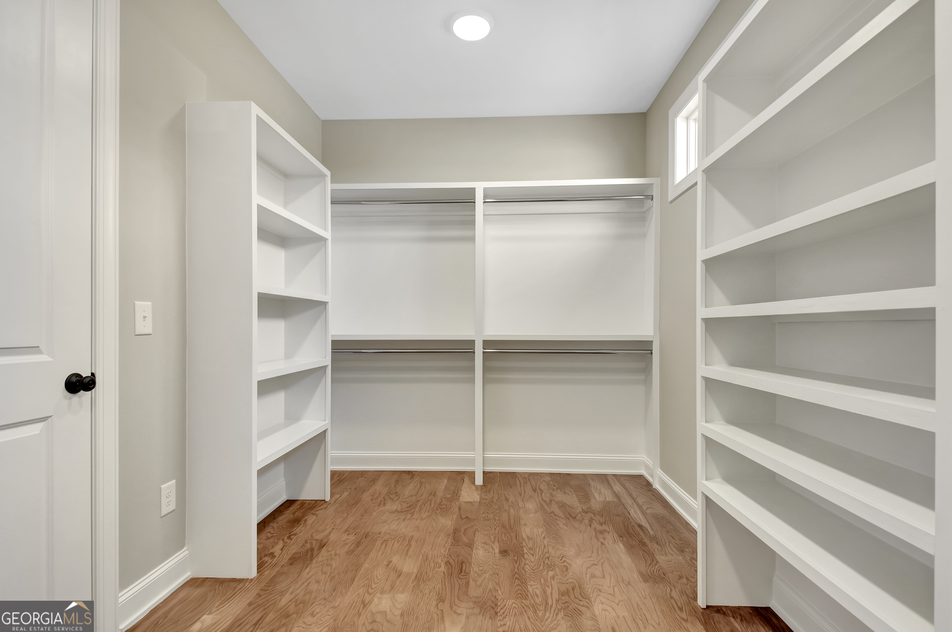 355 Werner Way Senoia, GA 30276 - Photo 57 of 118 a view of walk in closet with empty racks