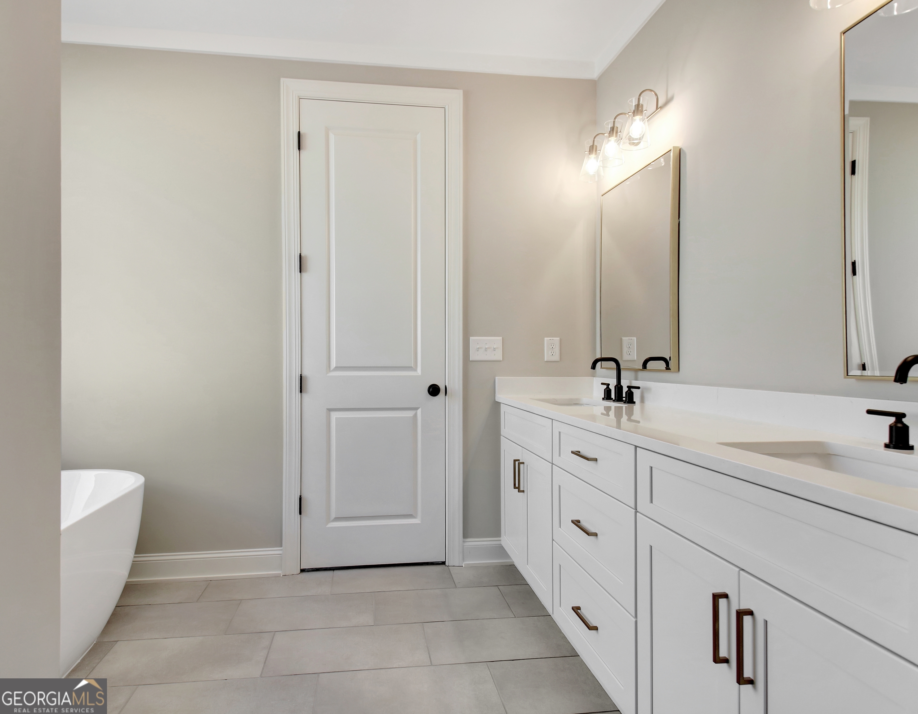 355 Werner Way Senoia, GA 30276 - Photo 62 of 118 a spacious bathroom with a double vanity sink a mirror and a