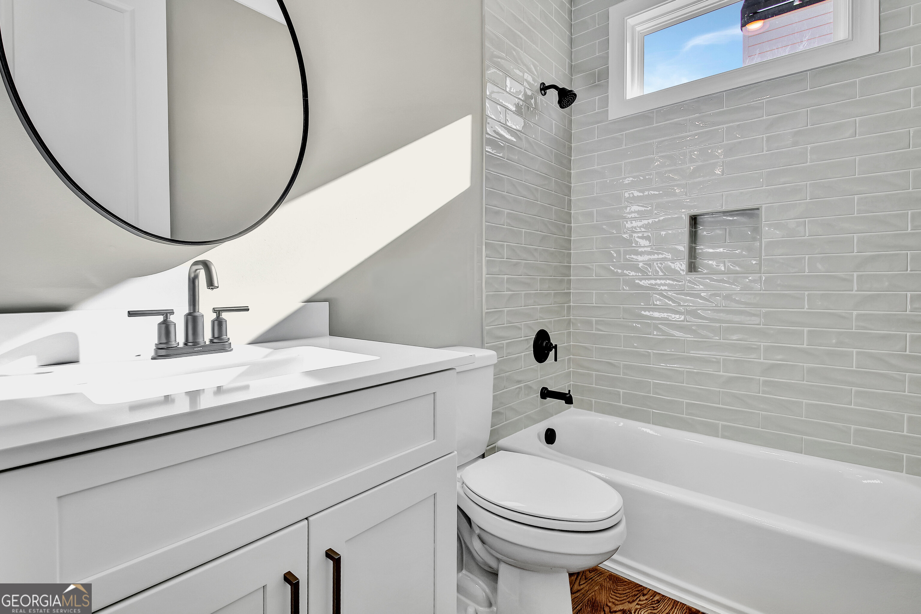 355 Werner Way Senoia, GA 30276 - Photo 66 of 118 a bathroom with a granite countertop toilet sink and mirror