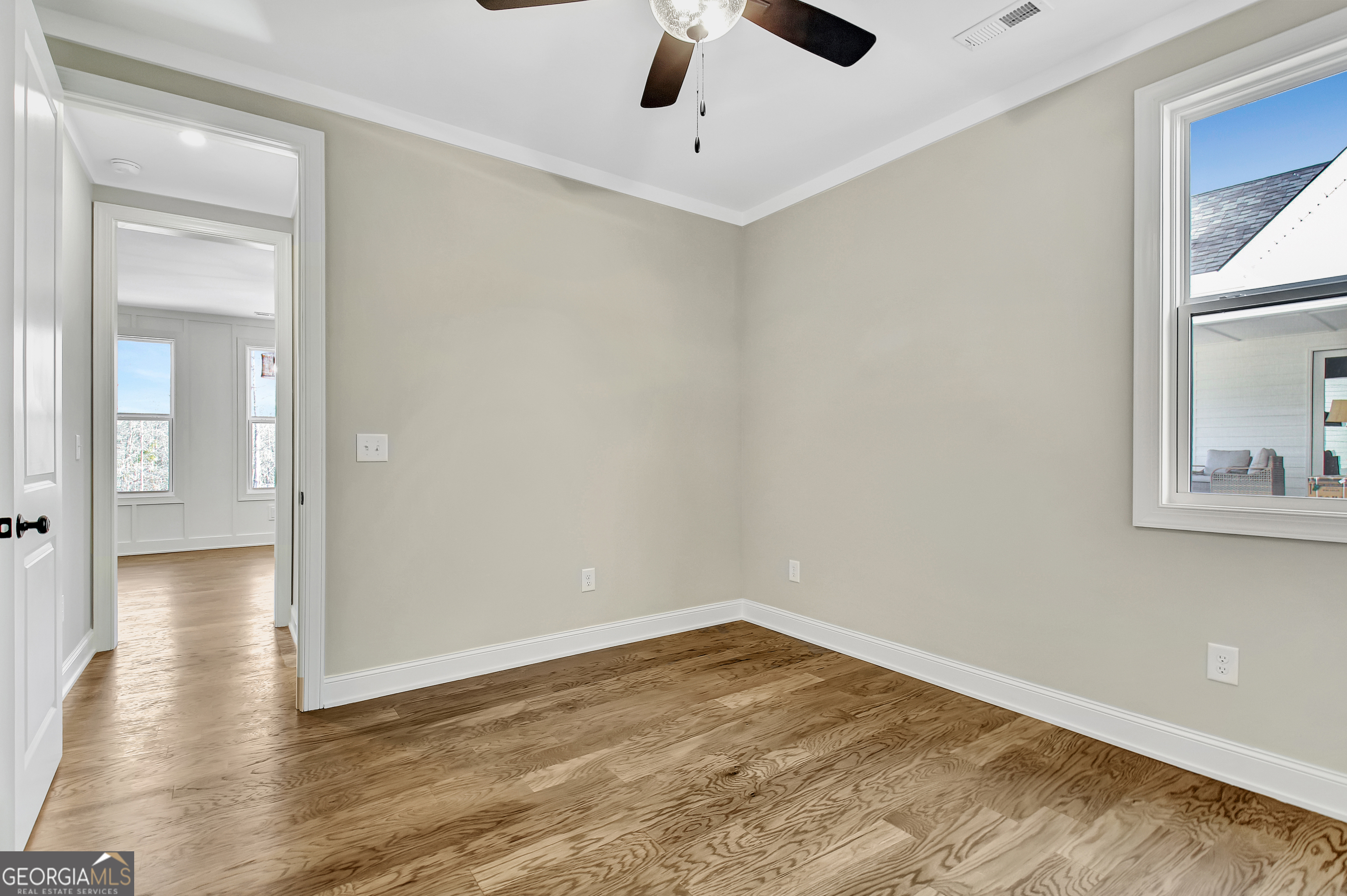 355 Werner Way Senoia, GA 30276 - Photo 68 of 118 a view of empty room with wooden floor and fan