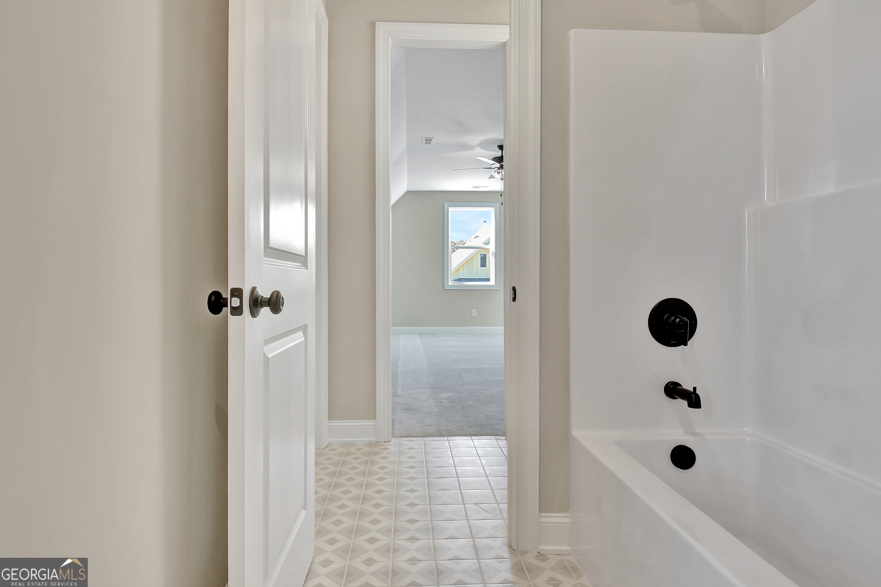 355 Werner Way Senoia, GA 30276 - Photo 89 of 118 a bathroom with a glass shower door