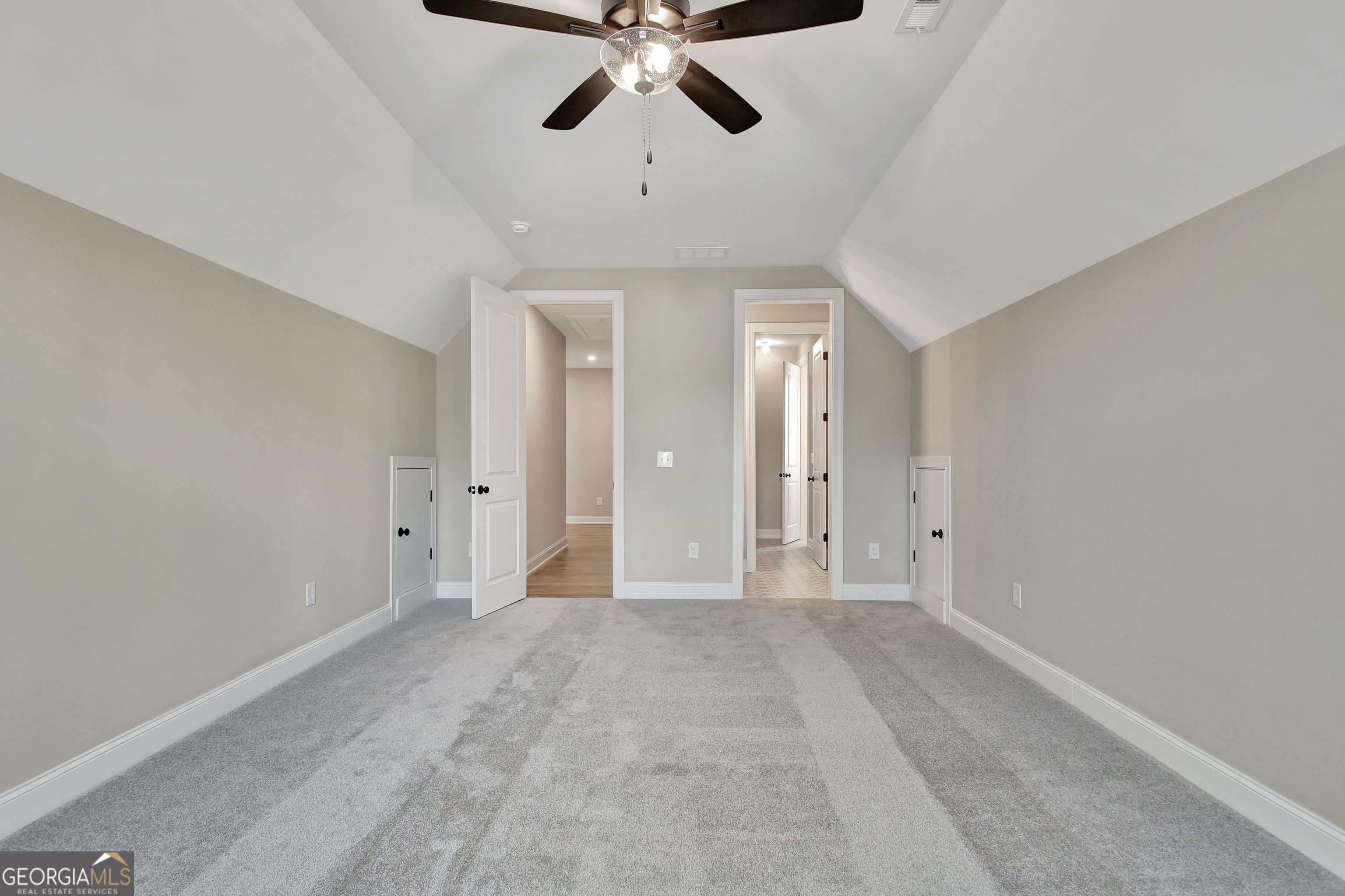 355 Werner Way Senoia, GA 30276 - Photo 96 of 118 a view of an empty room and chandelier fan