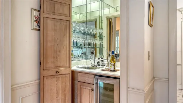 a bathroom with a granite countertop tub sink and mirror