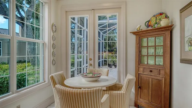a bathroom with a granite countertop sink a toilet a mirror a bathtub and shower