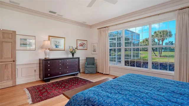 a view of a house with a big yard and large trees