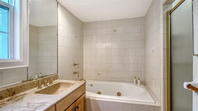 a front view of a house with yard and flowers