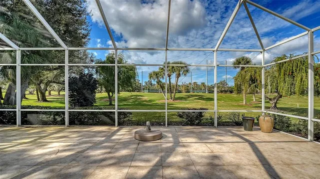 a very nice looking dining room with lots of furniture and chandelier