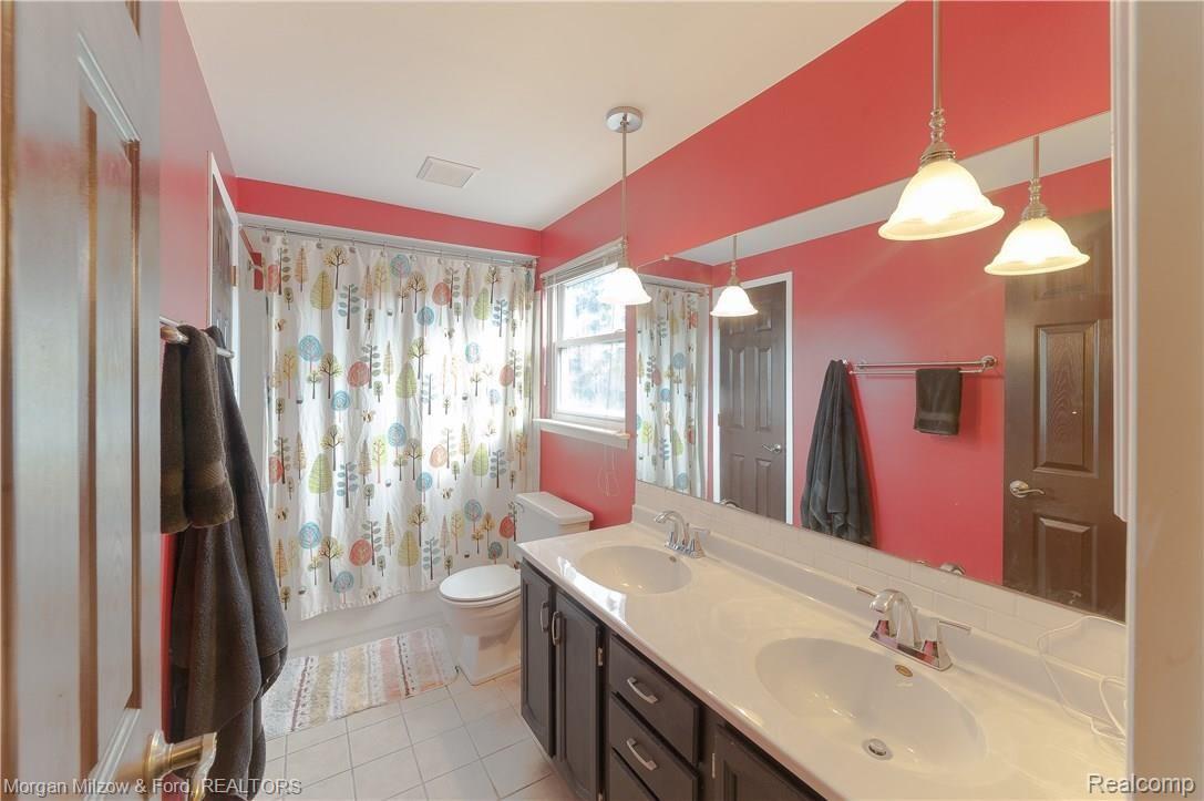 5400 Timber Ridge Trail Clarkston, MI 48346 - Photo 18 of 30 Newer fixtures/updated vanity/ceramic flooring