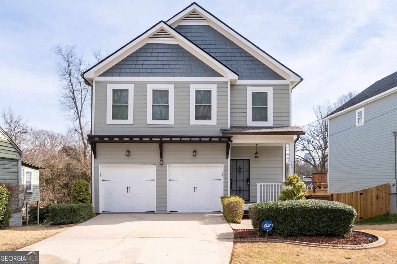 a front view of a house with a garage