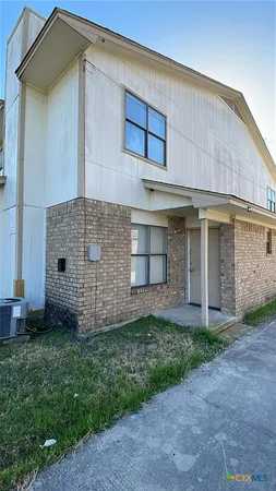a view of a back yard of the house
