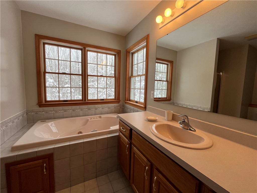 12837 Upton Road Victory, NY 13143 - Photo 25 of 48 Jacuzzi tub in bathroom to primary bedroom