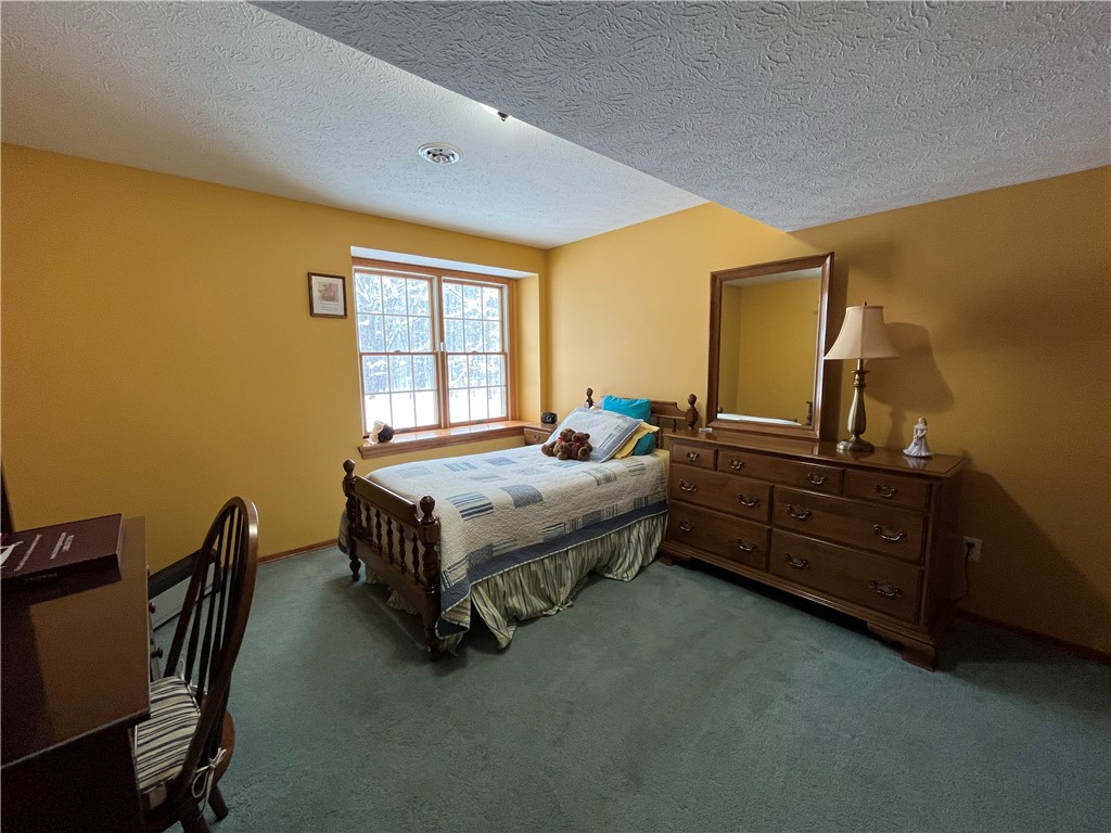 12837 Upton Road Victory, NY 13143 - Photo 37 of 48 Lower level bedroom with full windows