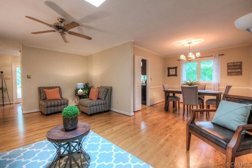 14208 Spring Gate Road Midlothian, VA 23112 - Photo 17 of 44 a living room with furniture and a wooden floor
