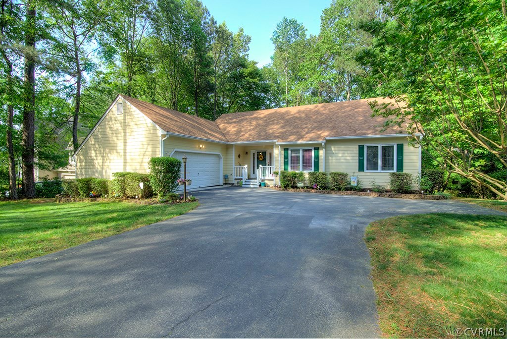 14208 Spring Gate Road Midlothian, VA 23112 - Photo 2 of 44 a front view of a house with a yard and green space