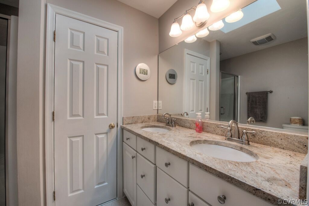 14208 Spring Gate Road Midlothian, VA 23112 - Photo 23 of 44 a bathroom with a granite countertop double vanity sink and a mirror