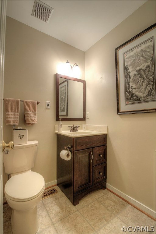 14208 Spring Gate Road Midlothian, VA 23112 - Photo 28 of 44 a bathroom with a toilet a sink and mirror