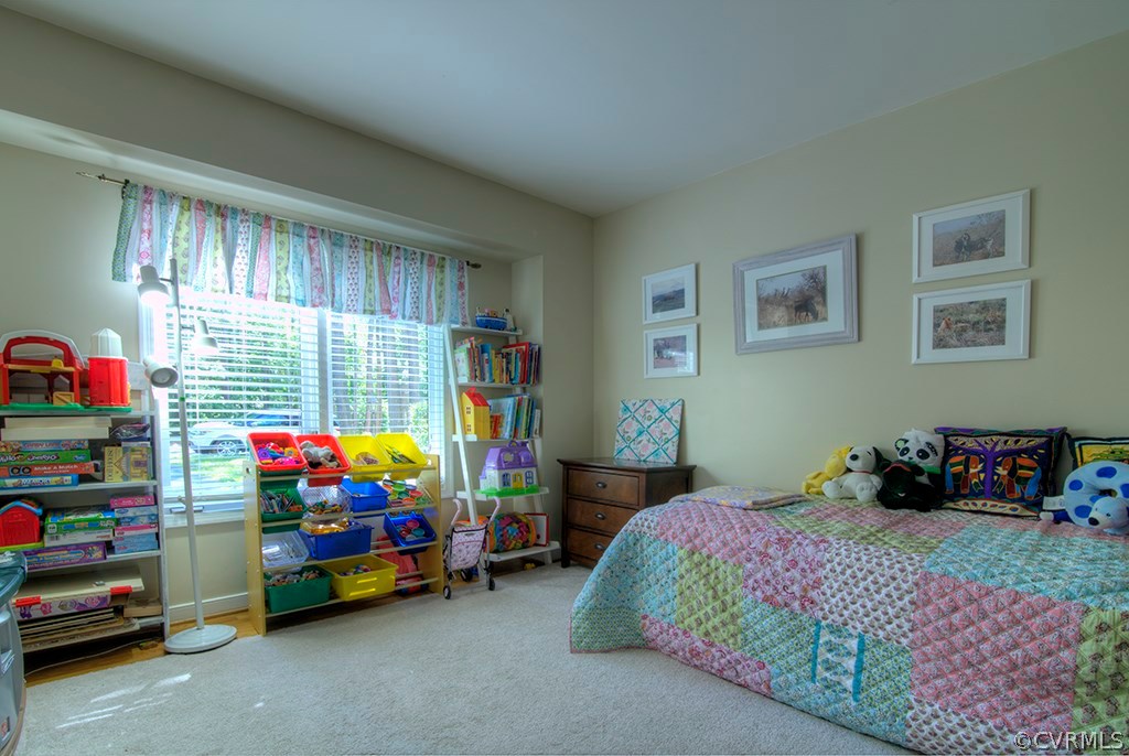 14208 Spring Gate Road Midlothian, VA 23112 - Photo 29 of 44 a bedroom with a bed and a window