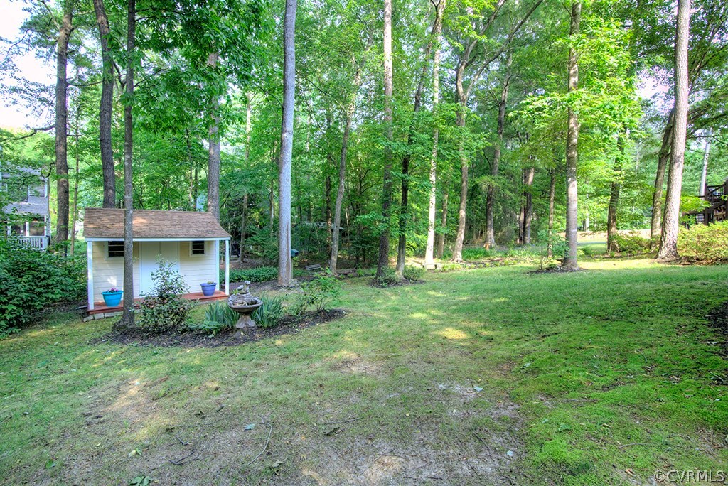 14208 Spring Gate Road Midlothian, VA 23112 - Photo 42 of 44 a view of a house with a yard