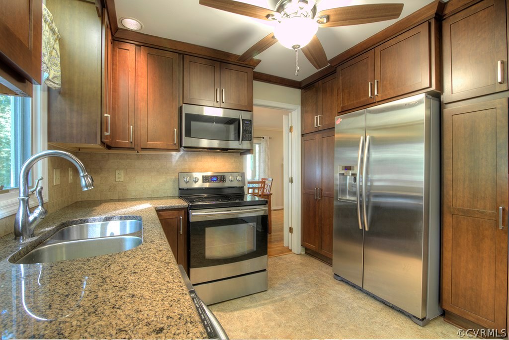 14208 Spring Gate Road Midlothian, VA 23112 - Photo 8 of 44 a kitchen with stainless steel appliances granite countertop a refrigerator a stove and a sink with granite countertops