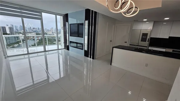 a view of a hallway with kitchen
