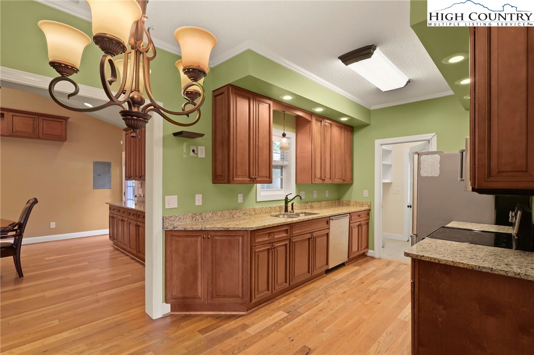 112 Rolling Hill Drive Boone, NC 28607 - Photo 11 of 31 a kitchen with lots of counter space and wooden floor