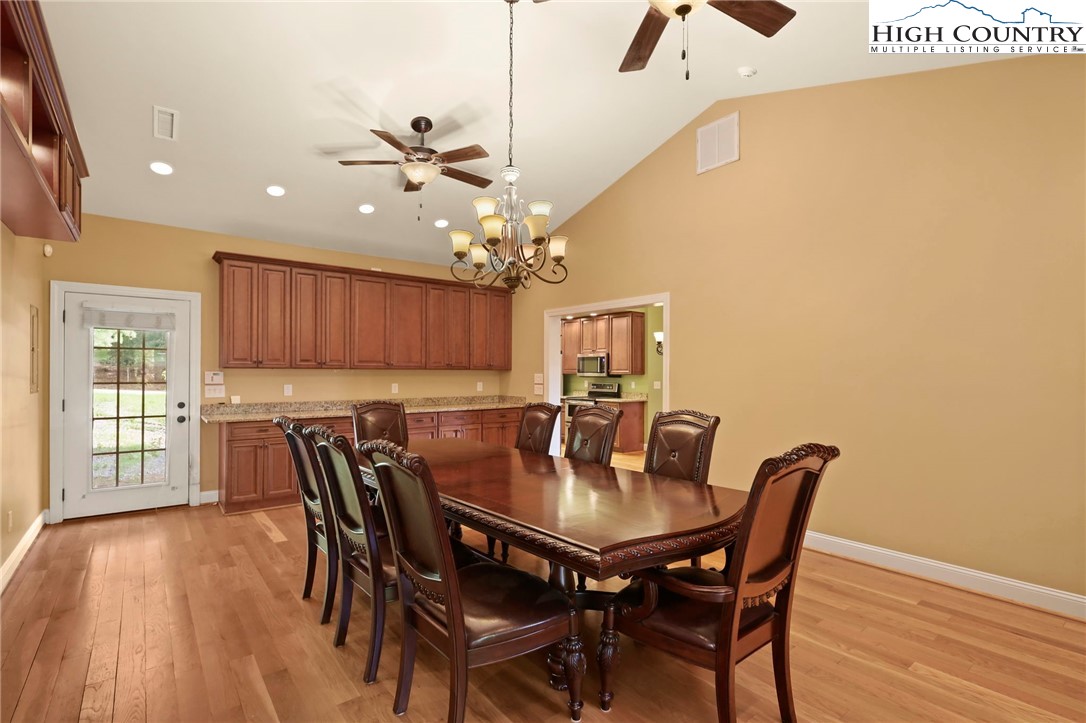 112 Rolling Hill Drive Boone, NC 28607 - Photo 15 of 31 a view of a dining room with furniture and wooden floor