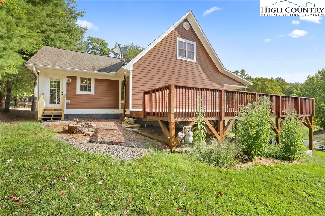 112 Rolling Hill Drive Boone, NC 28607 - Photo 2 of 31 a view of a house with backyard and sitting area