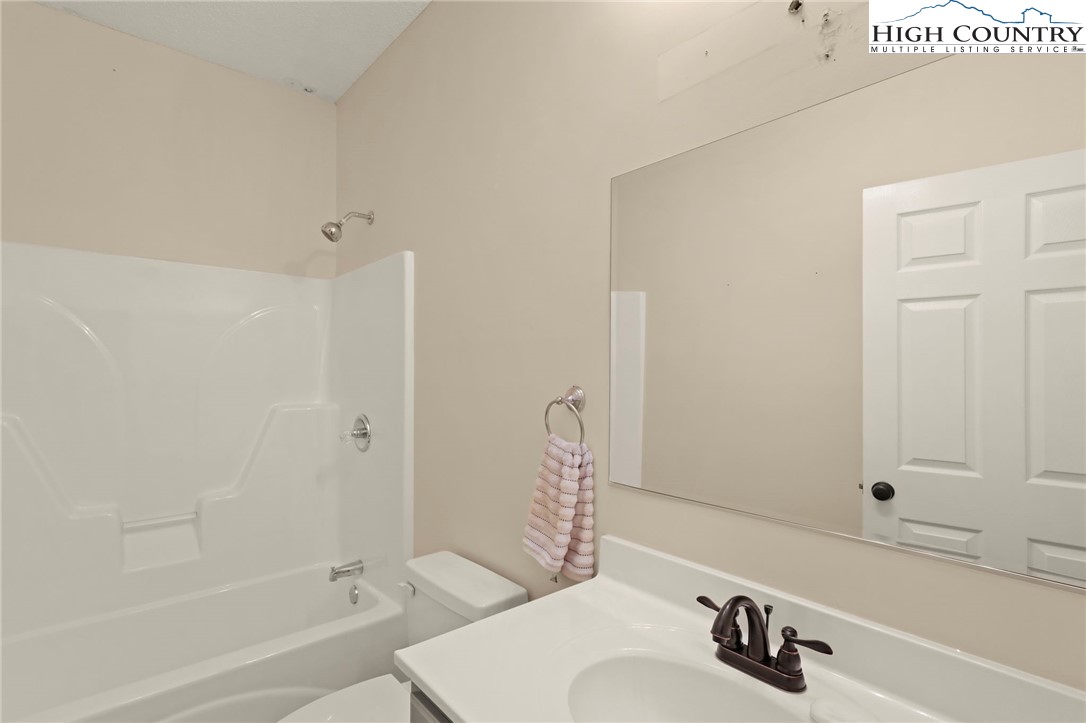 112 Rolling Hill Drive Boone, NC 28607 - Photo 21 of 31 a bathroom with a sink and a bathtub