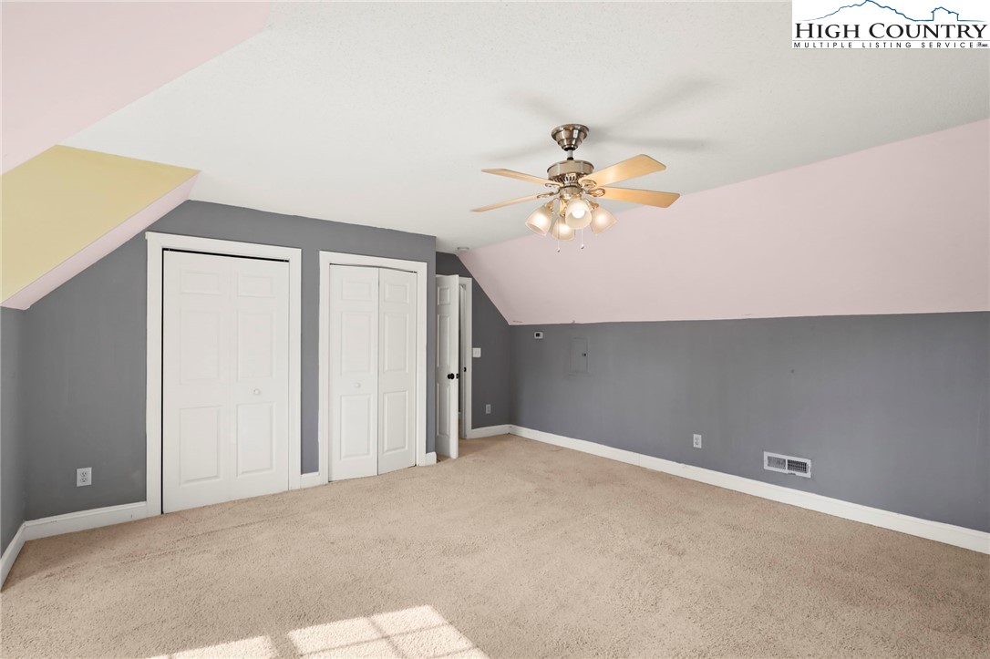 112 Rolling Hill Drive Boone, NC 28607 - Photo 24 of 31 an empty room with a chandelier fan