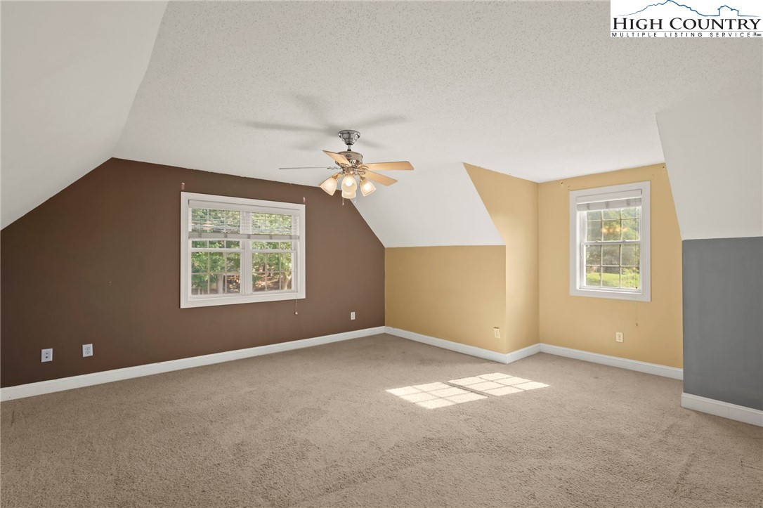 112 Rolling Hill Drive Boone, NC 28607 - Photo 25 of 31 an empty room with windows and fan