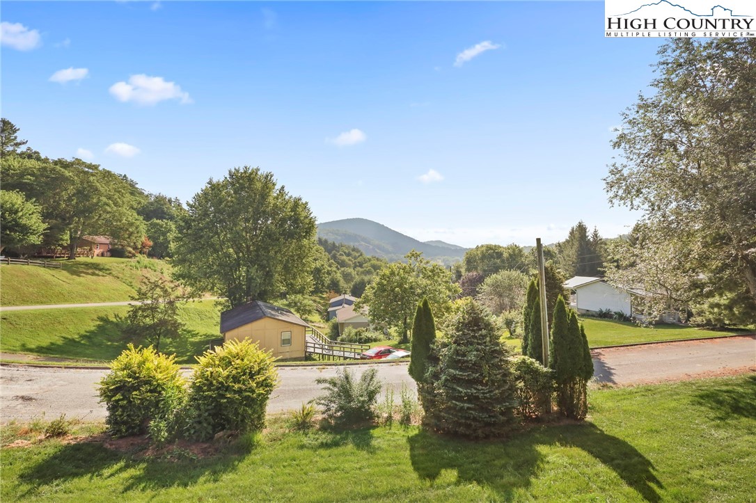 112 Rolling Hill Drive Boone, NC 28607 - Photo 4 of 31 a view of a lake with a yard