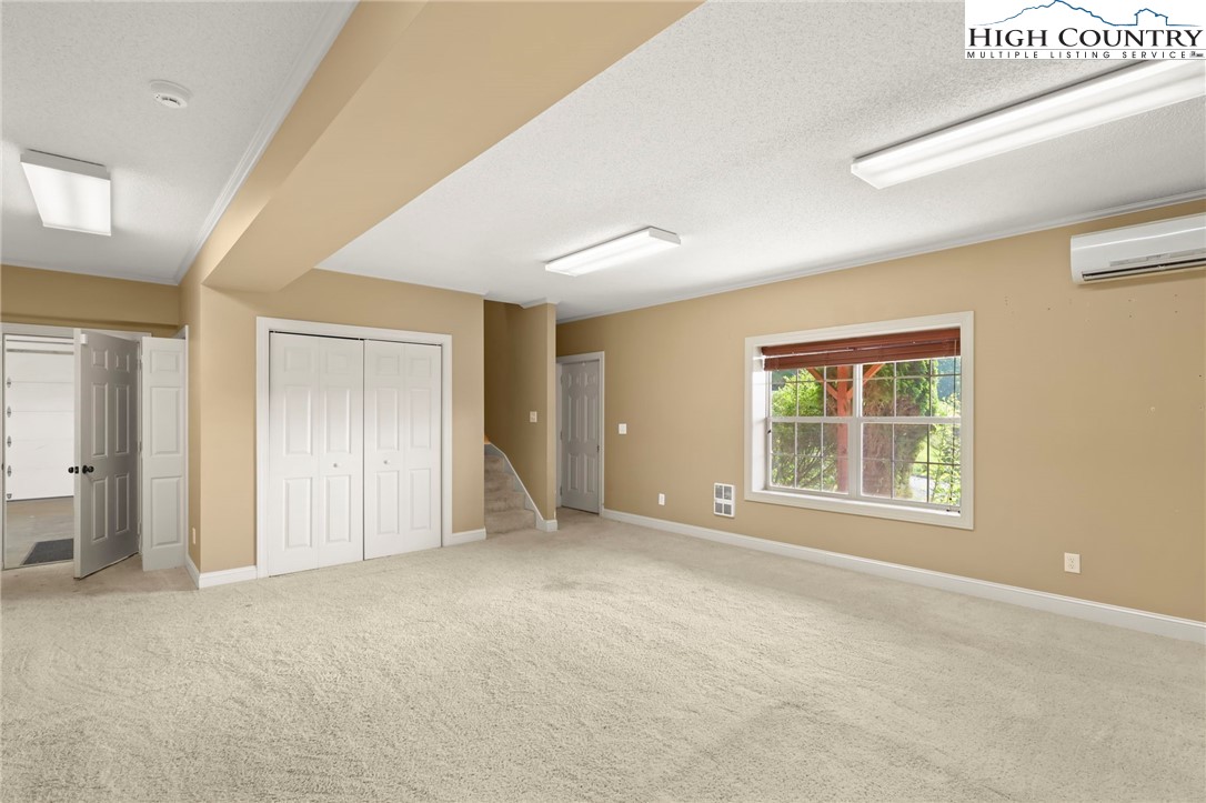112 Rolling Hill Drive Boone, NC 28607 - Photo 7 of 31 an empty room with windows and closet