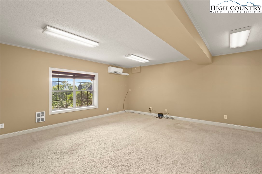 112 Rolling Hill Drive Boone, NC 28607 - Photo 8 of 31 an empty room with windows