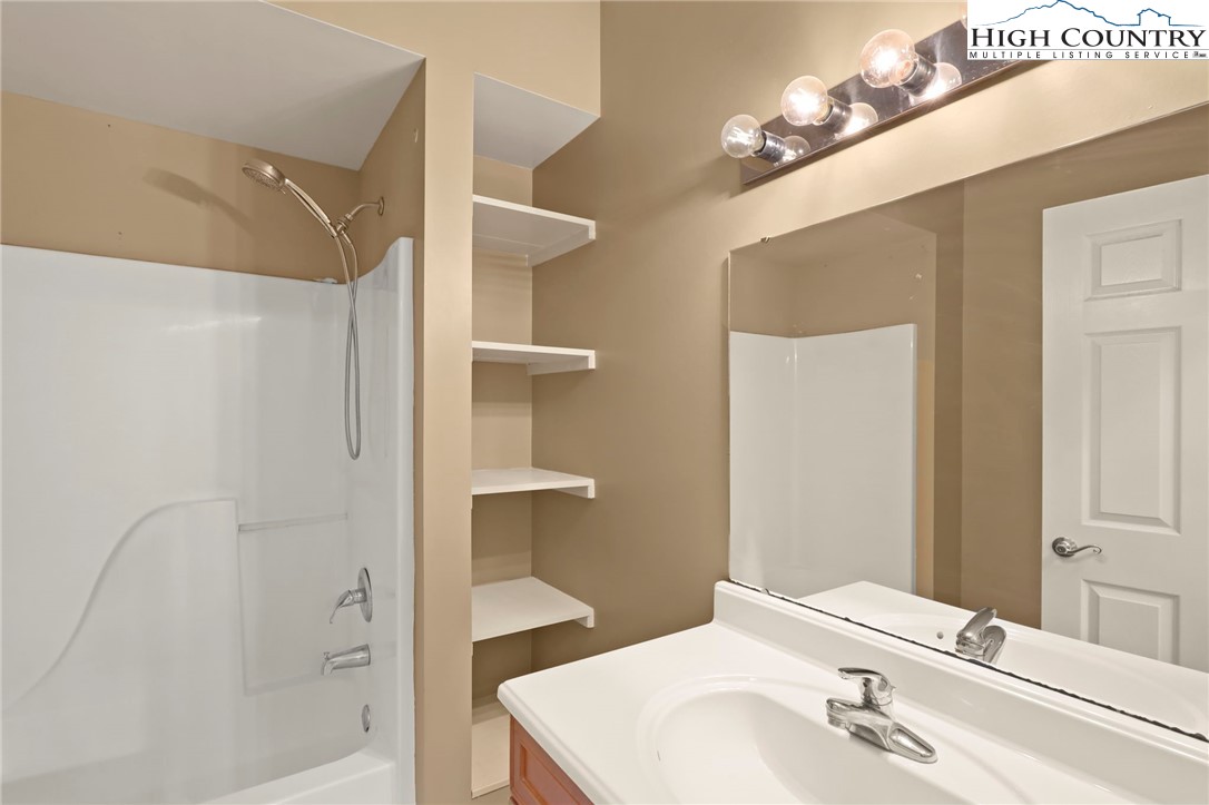 112 Rolling Hill Drive Boone, NC 28607 - Photo 9 of 31 a bathroom with a sink and a mirror