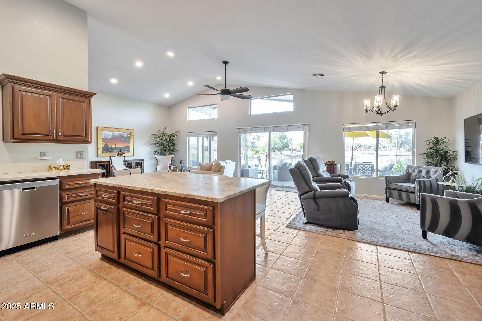 15460 West Merrell Street Goodyear, AZ 85395 - Photo 12 of 30 a kitchen with stainless steel appliances granite countertop a sink a stove and a refrigerator