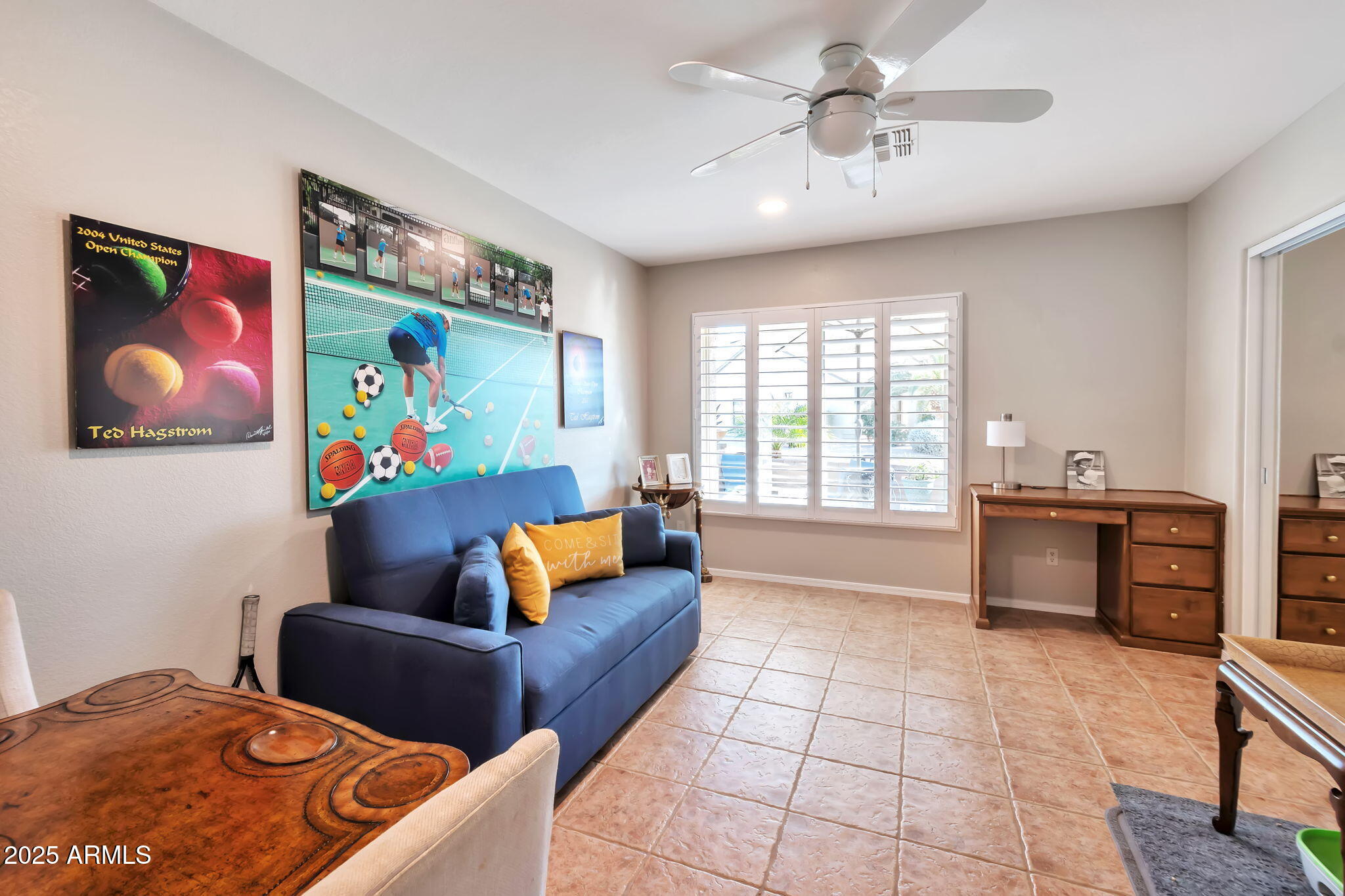 15460 West Merrell Street Goodyear, AZ 85395 - Photo 20 of 30 a living room with furniture and a flat screen tv