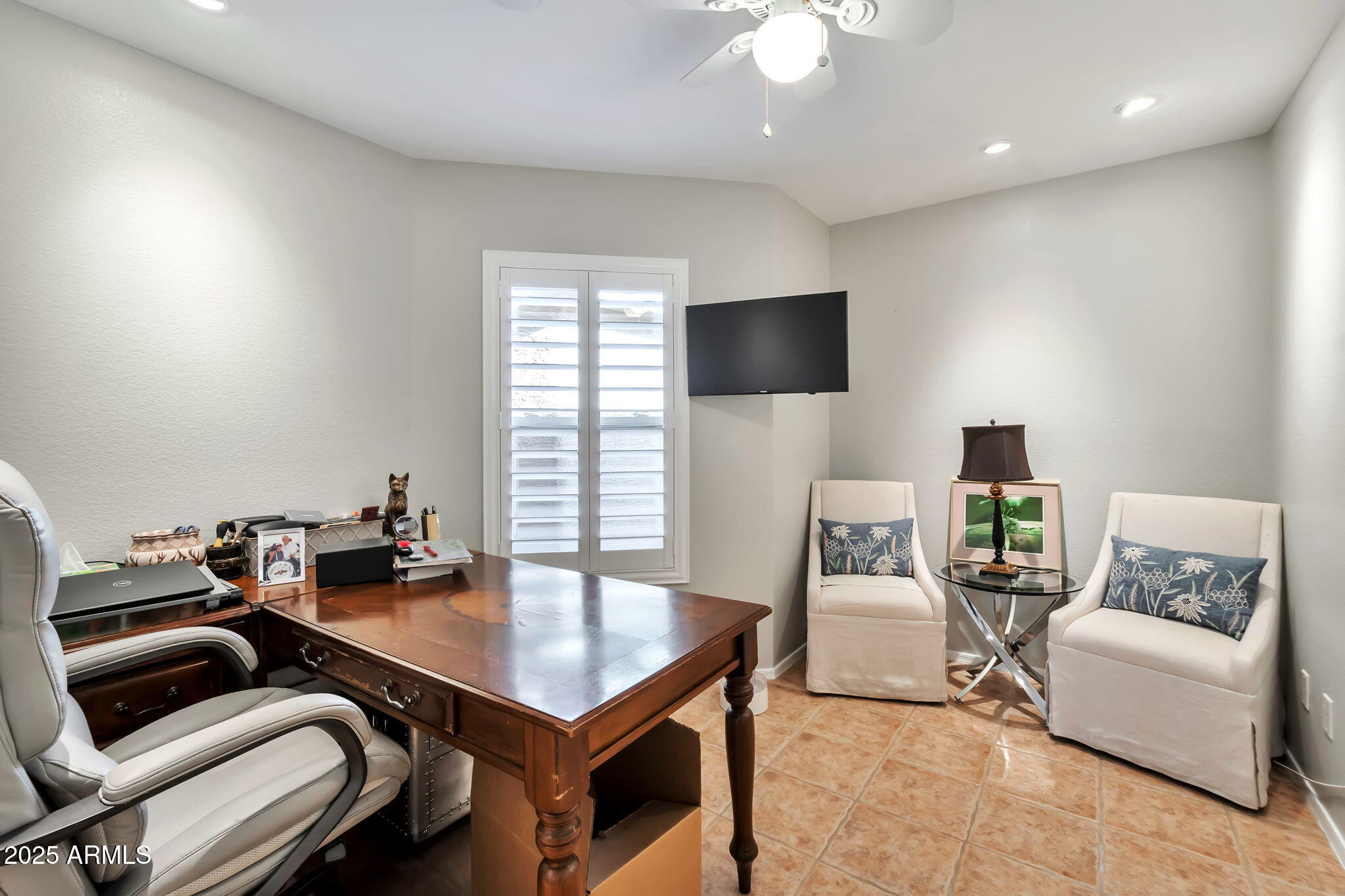 15460 West Merrell Street Goodyear, AZ 85395 - Photo 23 of 30 a living room with furniture and a flat screen tv